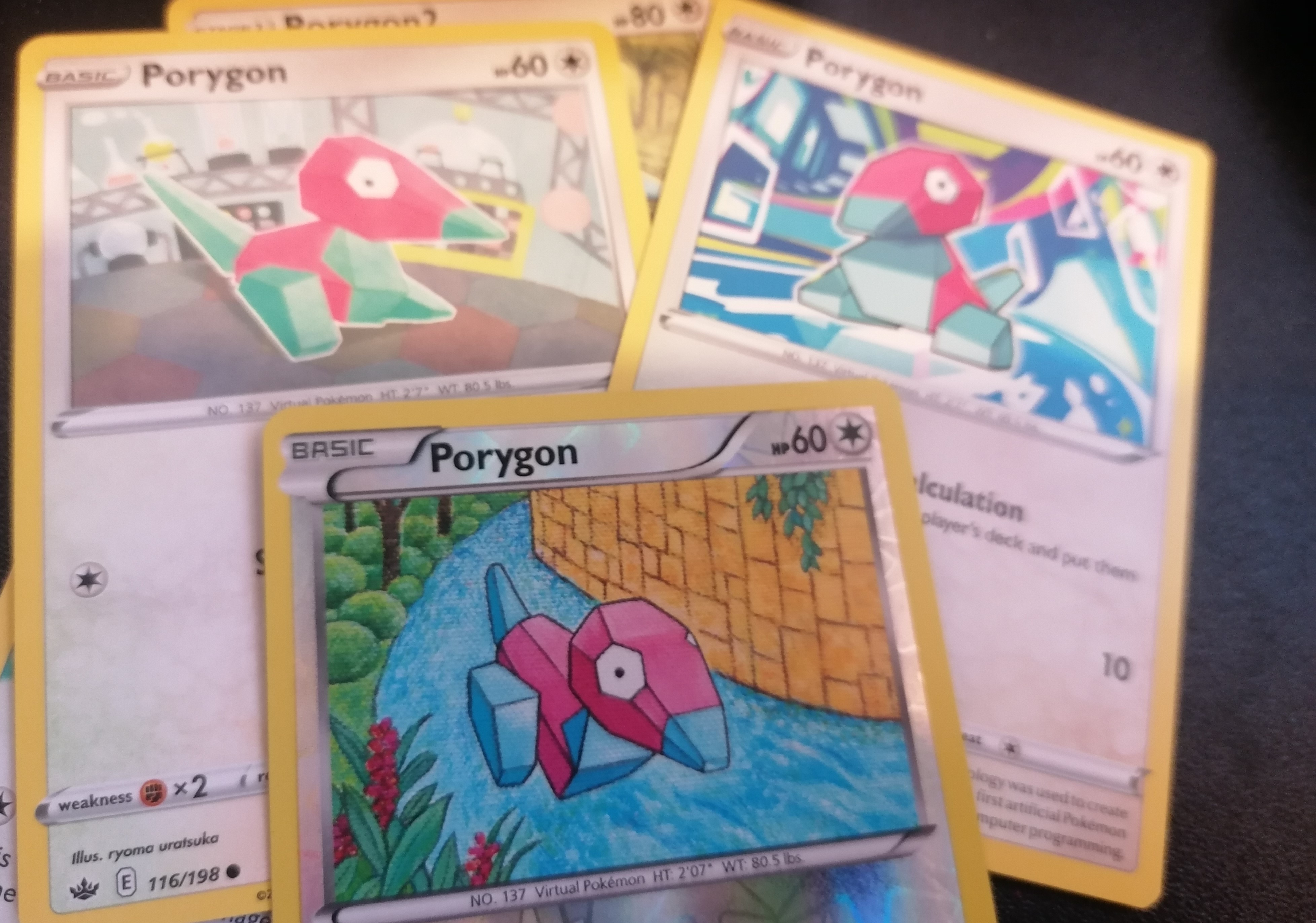 Three Porygon Pokemon cards. The images are small.
