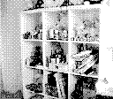 GIF of me rearranging objects on a shelving unit